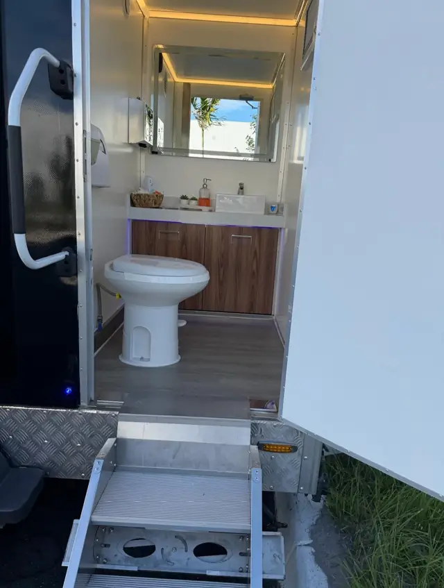 Flush toilet inside a restroom trailer