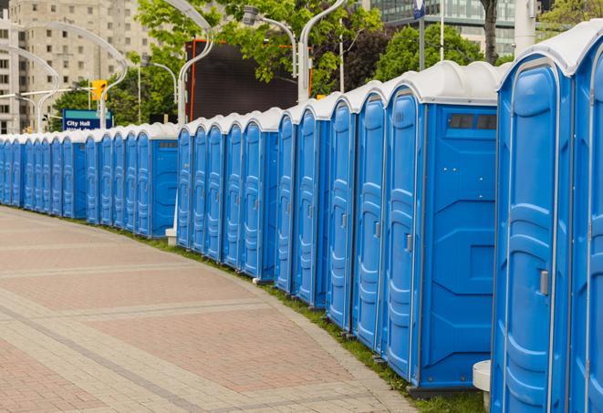 a row of portable restrooms at a fairground, offering visitors a clean and hassle-free experience in skedee